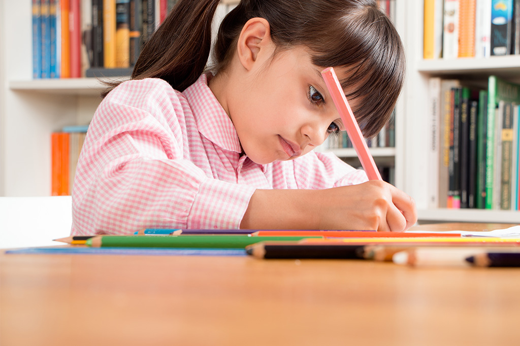 confident child studying with books