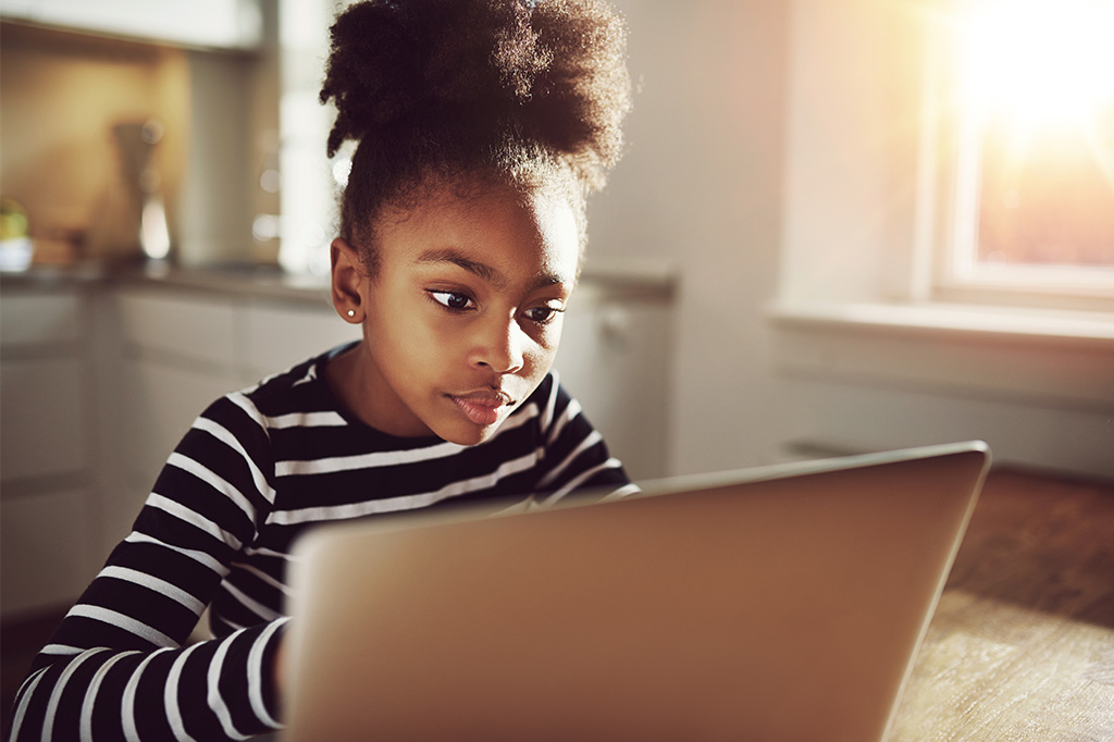 young child learning with computer