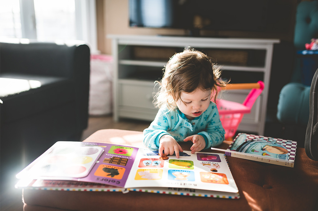 inquisitive child learns to read