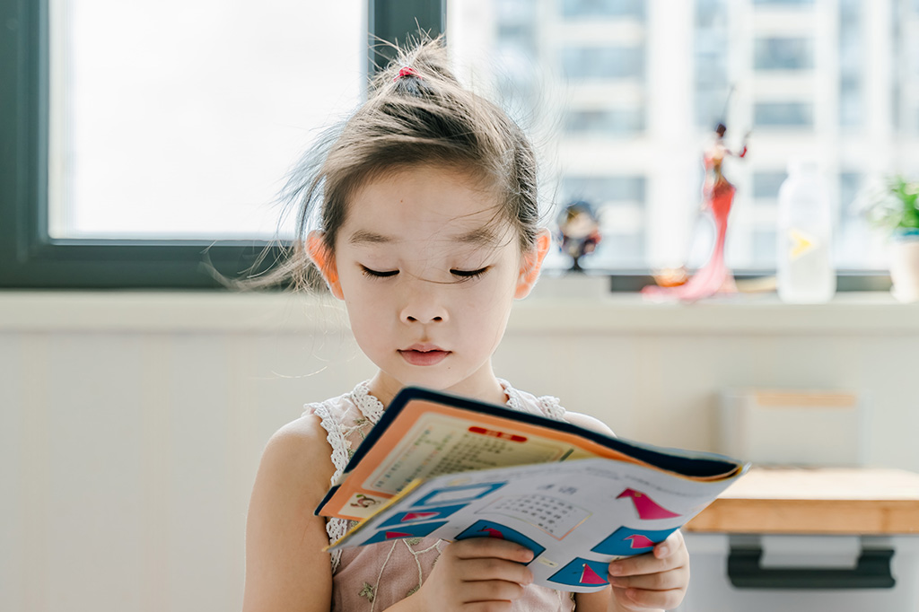 young child reading for pleasure