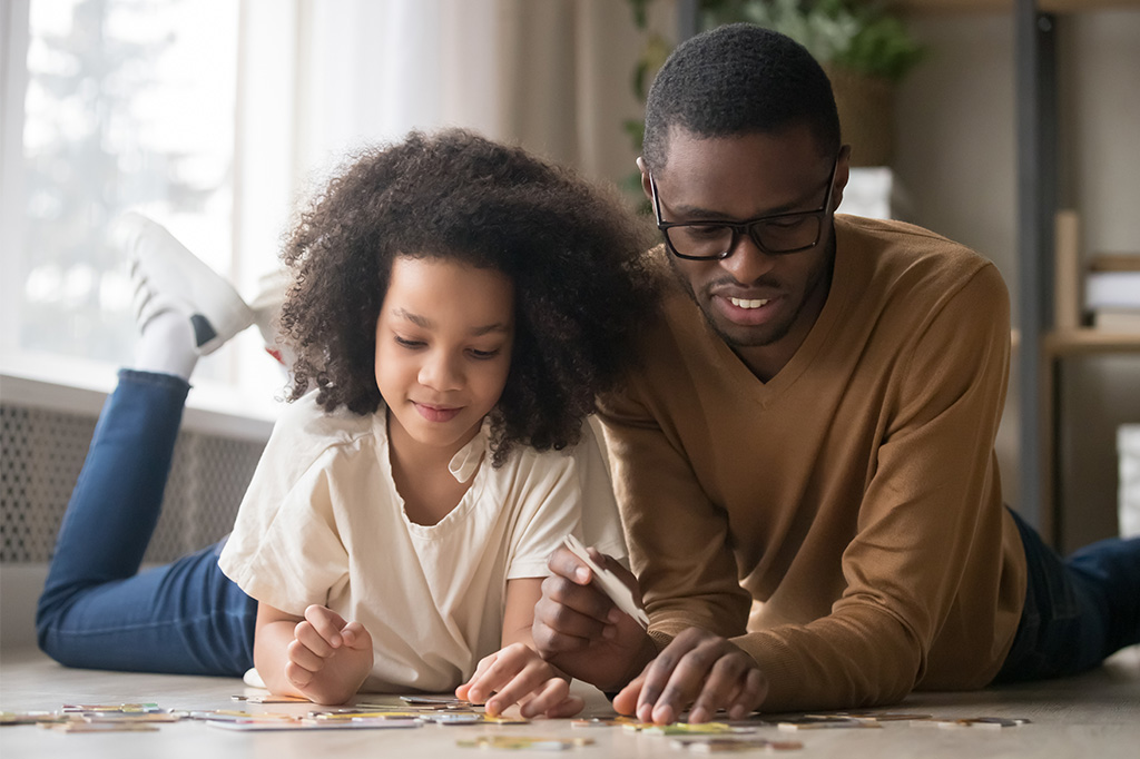 father and child learn by play