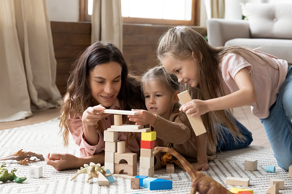 children learning by play with parent