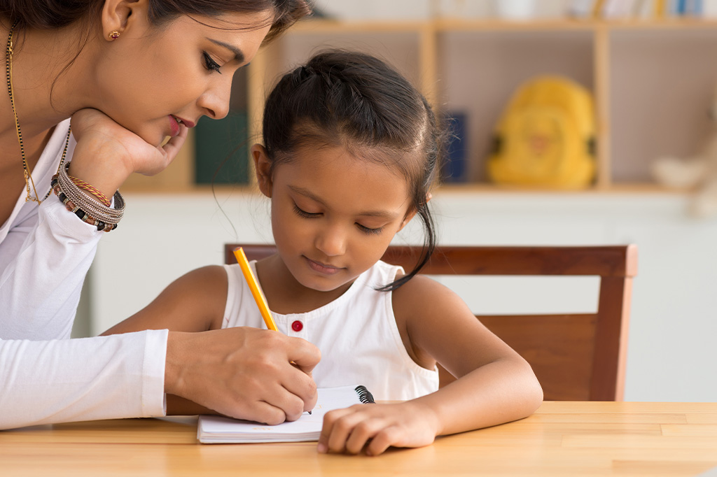 mother and child learn to write