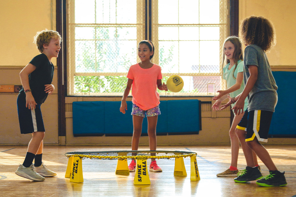 Children playing spike ball