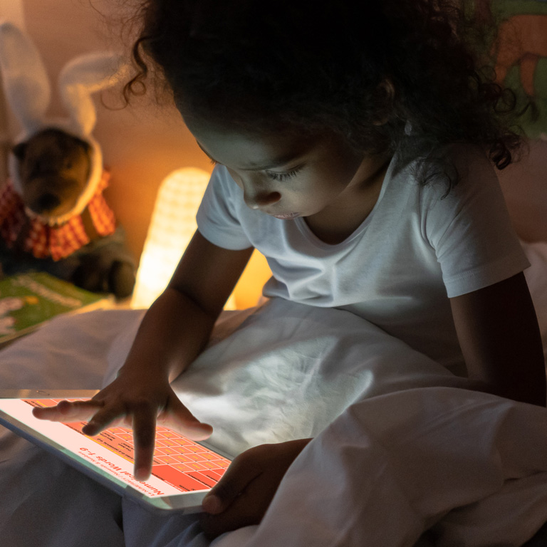 Primary pupil using Learnest study material on a digital device